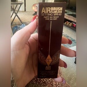 Charlotte Tilbury Airbrush Flawless Setting Spray with Gold and Brown Accents